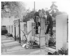 North Hollywood, CA - Campo de Cahuenga - Woman locked in park - Police officer John T. Schillo (left) and Police officer Glenn A. Kuhn (right) and Mrs. Albert J. Kohanover (center)