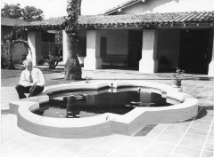 North Hollywood, CA - Campo de Cahuenga - William Allen, President of Campo de Cahuenga Memorial Association of California, seated by pool