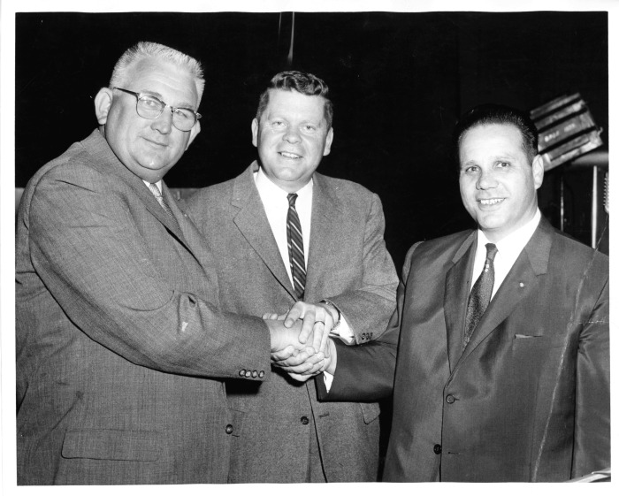 San Fernando, CA - San Fernando Chamber of Commerce - Elvin Schmidt (left) takes office as new President, succeeding Frank Modugno (right). County Supervisor Warn M. Dorn (center) conducted installation ceremonies