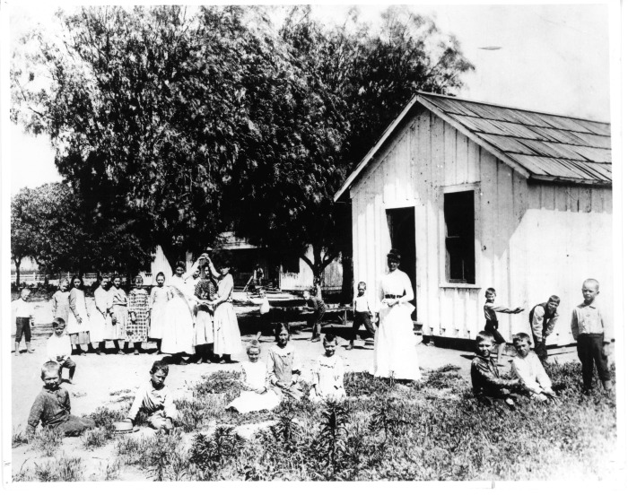 First school in North Hollywood, CA - Located in a bunk house on the A.P. Hoffman Ranch, about 11016 Kling Street - W.H. Andrews was the school superintendent and the teacher was Anna Crawford - Some of the children have been identified in the photo: Henry Bakerman, Alex Beeman, Dema Reese, ? Reese, Jessie Kiesling, Minnie Andrews, Ethel Finney, Nellie Dietrich, Kate M. Lschler (sic), Louis Toby, Myrtle Reese, Della Finney, Maud Finney, Laura Woods, Theresa M. Lschler (sic), Julia Dietrich, Georgia York, Dan Bakerman, Eddie Dietrich, Willie M. Lschler (sic), Charlie Bakerman, Walter York, Gertie and Ed Richardson, and Jim Stratton