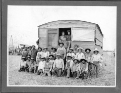 San Fernando Valley, CA - Migrant farm workers in front of living quarters - People not identified