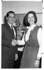 Edwin Reinecke congratulates unidentified woman