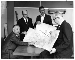San Fernando, CA - San Fernando Planning Department persons look over map of San Fernando Valley. Only person identified is Rudy Gunnarson, Chief City Engineer on far left