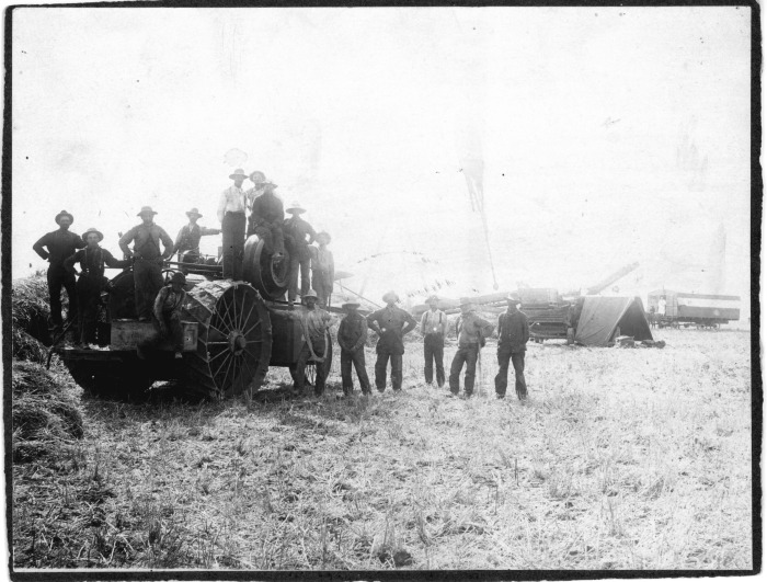 San Fernando Valley, CA - Farming - Unidentified men standing in front of farm equipment - Tent on right