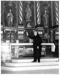 San Fernando, CA - St. Ferdinand Catholic Church - Father John O'Connell shows hand carved altar to be dedicated