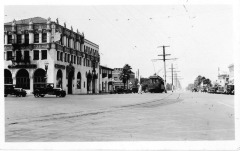San Fernando, CA - View of a hotel, BPOE Lodge, and street car at San Fernando Rd. and Brand Blvd.