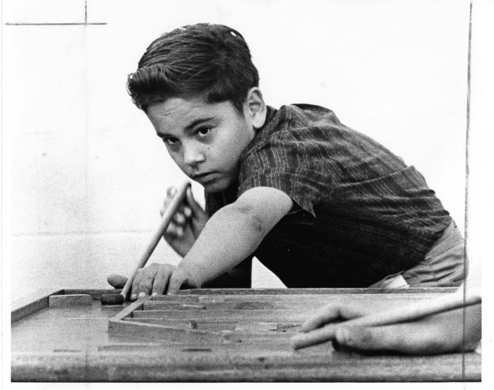 Canoga Park, CA - Our Lady of Guadalupe Center - Robert Valenzuela plays "carrom's"