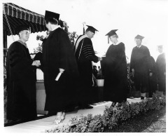 Northridge, CA - Valley State College (CSUN) - Commencement at Valley State College - Anne Baille, second from left, receives diploma - Others are not identified