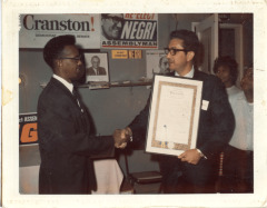 Davia Megri presenting resolution to Bill Stewart
