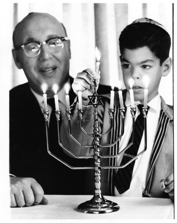 Hanukkah - Rabbi Margolis instructs Mark Luvin in rites of observance