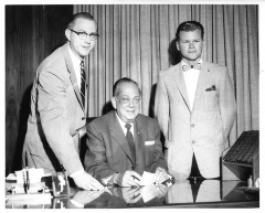 Northridge, CA - San Fernando Valley State College (CSUN) - Edwin Murdock (right) accepts Valley Times scholarship from Russell A. Quisenberry of the Valley Times Publisher. Taking part in the presentation is Professor of Journalism Zrling H. Erlandson