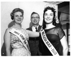 Northridge, CA - San Fernando Valley State College (CSUN) - Miss Flashbulb Queen crowned - Cindy Swanson (right), Rachael O. Blenis (left), and Erloing Eradspm. Journalism Professor