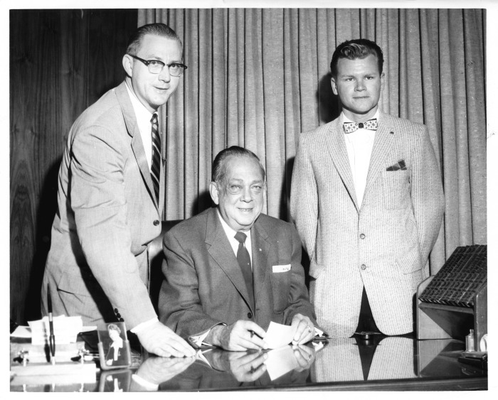Northridge, CA - San Fernando Valley State College (CSUN) - Edwin Murdock (right) accepts Valley Times scholarship from Russell A. Quisenberry of the Valley Times Publisher. Taking part in the presentation is Professor of Journalism Zrling H. Erlandson