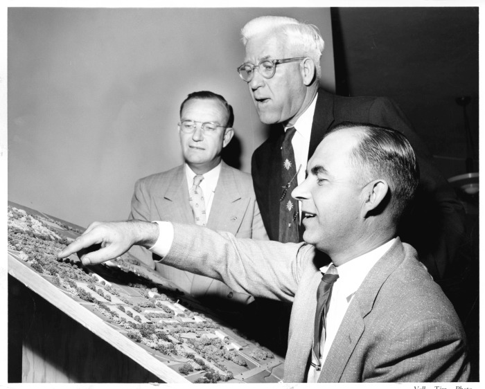 Northridge, CA - San Fernando Valley State College (CSUN) - Dr. Delmar Oviatt and Wallace O. Lindstrom, President of Van Nuys Chamber of Commerce view model of college as Dr. Howard S. McDonald, President of the college explains the plan