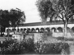 San Fernando Mission, San Fernando, California - Convent (long building) shown from Brand Park, with fountains in foreground