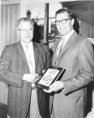Chamber of Commerce presenting H.G. Donewalt with plaque for outstanding performance as Director and Chairman of the Membership Committee